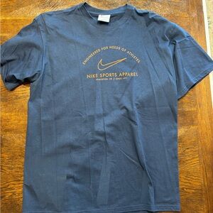 Nike Men's Navy Tee with Gold Logo